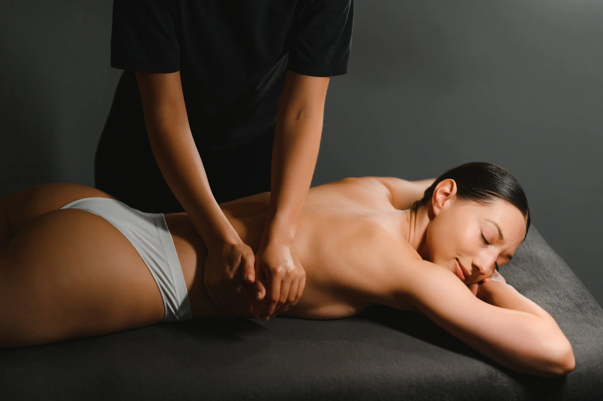 Anma Massage: What You Need To Know - 1920 masseur doing massage on woman body in the spa salon beauty treatment concept 1