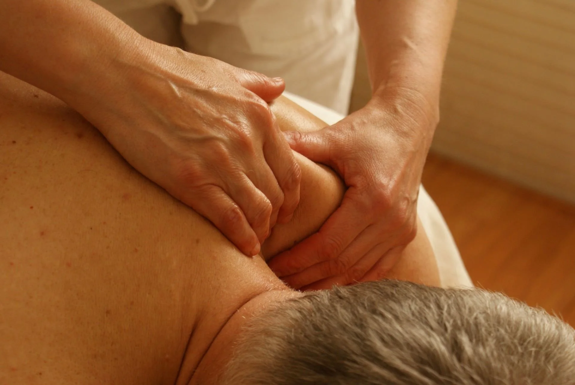 Neuromuscular Massage vs Deep Tissue Massage: Understanding the Differences A-man-is-getting-deep-tissue-massage