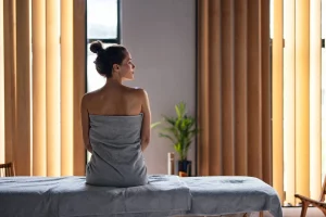 What Happens to Your Body After a Massage? What Happens to Your Body After a Massage? - BeautifulWomanSittingontheMassageBedattheSpa