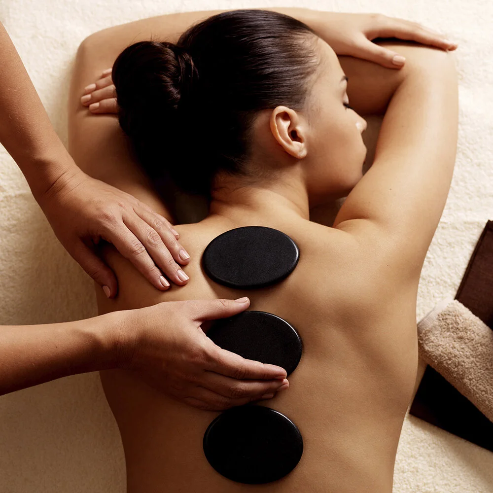 Hot Stone Massage: Benefits and Cautions - hot stone massage